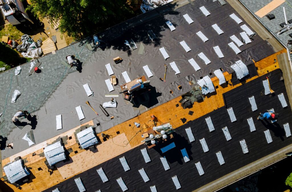 A Kings Roofing & Contracting roofer repairing shingles on a Donnelly, ID home, ensuring strong weather resistance and dependable long-term roof performance.