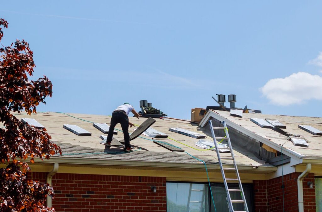 A Kings Roofing & Contracting roofer installing new shingles in Valley County, ID, ensuring strong protection and quality results.