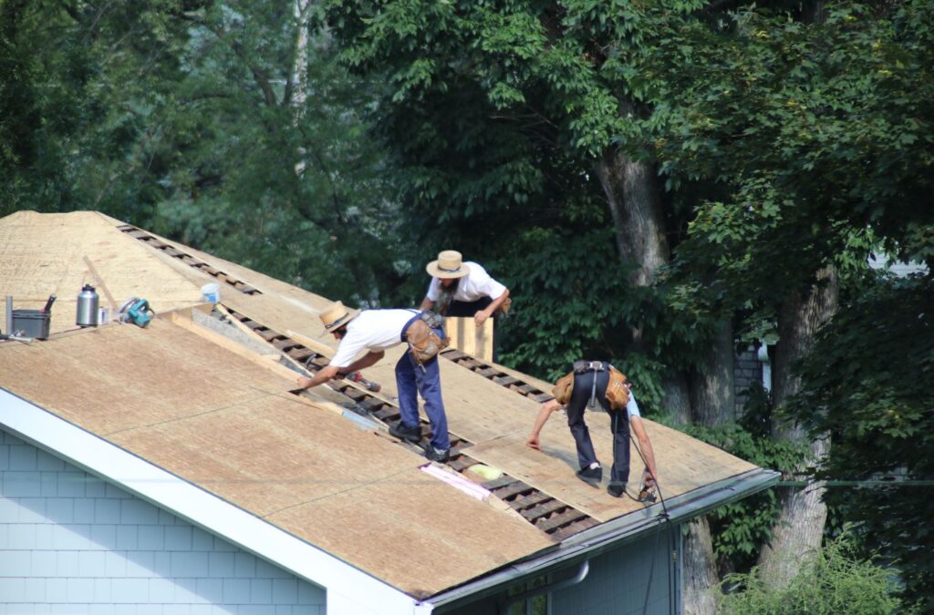 Kings Roofing & Contracting experts inspecting roof damage on a McCall, ID home, showcasing precise repair techniques and reliable service for local homeowners. Roof Repair near me.